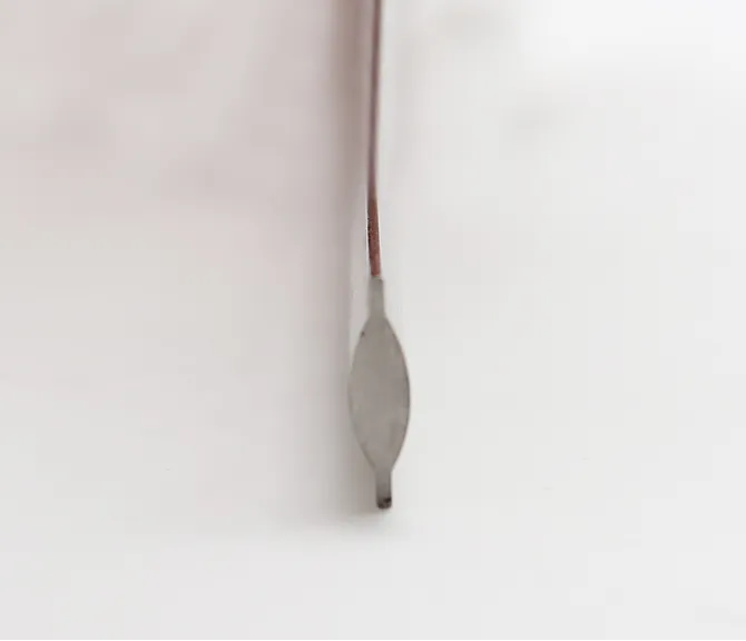 Vertical end profile of brushed metal tube