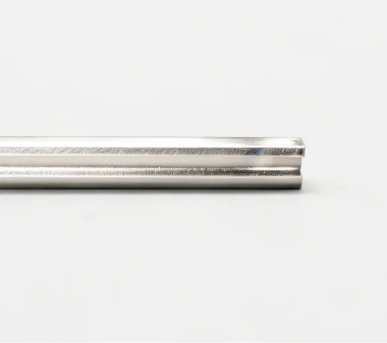 A polished H-shaped wire profile with a central groove