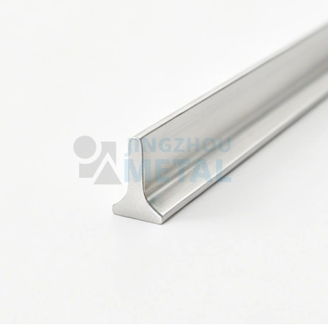 Close-up of T-shaped stainless steel profile wire with smooth silver finish